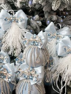 blue and silver christmas ornaments with white feathers