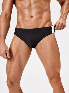 Elevate your swimwear collection with our Contrast Striped Panel Swim Brief. These swimwear bottoms boast a sleek design with contrasting panels that add a modern and stylish touch. Crafted from high-quality materials, they offer a comfortable and supportive fit, allowing you to move with confidence in the water. Features: Pattern Type: Striped Type: Briefs Fabric: High Stretch Material: Fabric Composition: 82% Polyester, 18% Spandex Size Chart ( Inches ): Size Length Waist Size S 10.5 28.3 M 11 Sporty Water Polo Brief Swimwear, Sporty Stretch Swim Trunks For Water Polo, Sporty Swimwear Briefs For Swimming, Sporty Brief Swimwear For Water Polo, Sporty Brief Swimwear For Swimming, Sporty Brief Swimwear, Modern Black Swimwear For Pool, Sporty Stretch Swimwear Briefs, Sporty Swimwear With Contrast Trim For Poolside