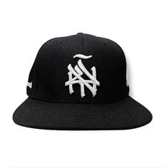 Introducing our New York (ÑY) Hometown Logo Snapback Hat – featuring our remixed 3d embroidered logo with a tilde design on the front, under brim is gray, the right side features our Nueva York "Split Logo" design and the left side highlights a "Latinos Unidos" emblem with flags from Colombia, Puerto Rico, Dominican Republic and Mexico. Our “NY Hometown Logo” intertwines the "N" and "Y," inspired by the Yankees and Mets interlocking insignias; merging classic sports heritage with a handmade, sty Mug Storage, Logo With A, Street Culture, Hats For Sale, Hat Pins, Dominican Republic, Snapback Hat, Right Side, Snapback Hats