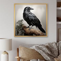 a black bird sitting on top of a tree branch in front of a white wall