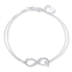 Display your love for your family through this delightful bracelet featuring an infinity symbol with the word "family." The pendant is held by a 7-inch double cable chain that fastens with a lobster clasp. Infinity Family, Bracelet For Her, Jewelry Education, Trending Bracelets, Silver Ring Designs, Jewelry Advice, Kay Jewelers, White Bracelets, Motivational Gifts