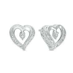 These diamond accent heart stud earrings are fashioned in sterling silver and secure with friction backs. Silver Heart Earrings With Diamond Accents For Anniversary, Classic Heart Earrings With Diamond Accents For Anniversary, Silver Heart-shaped Diamond Earrings For Anniversary, Silver Heart Cut Diamond Earrings With Accents, Silver Diamond Earrings For Anniversary On Valentine's Day, Anniversary Double Heart Earrings With Diamond Accents, Anniversary Heart Earrings With Diamond Accents, Valentine's Day Heart-shaped Silver Diamond Earrings, Silver Heart-shaped Diamond Earrings