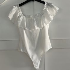 New With Tags Tcec White Ruffle Bodysuit. Size Large. Snap Closure. Can Be Work On Or Off The Shoulders. Chic Summer Bodysuit With Ruffles, Feminine Ruffle Bodysuit For Parties, Feminine Ruffled Bodysuit For Party, Chic One-piece Ruffled Bodysuit, Elegant White Bodysuit With Ruffles, Feminine Ruffled Party Bodysuit, Chic Sleeveless Bodysuit For Brunch, Trendy Sleeveless Bodysuit With Ruffles, Trendy Sleeveless Ruffled Bodysuit