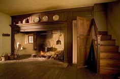 an old fashioned fireplace in the corner of a room