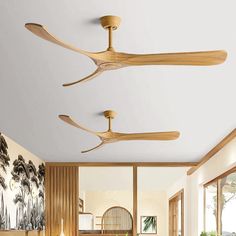 three wooden ceiling fans are hanging from the ceiling