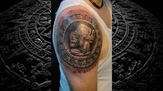 a man with a tattoo on his arm and shoulder, next to an image of the god