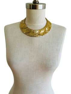 "Elegant Les Bernard collar choker necklace, featuring an Egyptian Revival motif in soft pale gold with a brushed finish. Comprised of 68 interconnected segments through an internal chain, this sophisticated accessory is perfect for achieving your Cleopatra-inspired ensemble! Size: 16\" length. 1-1/4\" wide.  Weight: 216.2 grams. Condition: Very good condition with light gold wear.  Markings: Unmarked. Les Bernard is the maker of this necklace." Medieval Gold Choker Necklace, Egyptian Jewelry Necklaces, Egyptian Necklace Collars, Gold Bib Necklace Choker, Egyptian Bird, Egyptian Accessories, Egyptian Clothing, Egyptian Necklace, Choker Collar Necklace