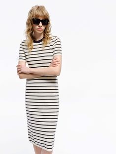 MO&Co. Women's Round Neck Striped Dress Crafted with a blend of wool and fabric, this mid-length T-shirt dress boasts a modern silhouette and stylish striped design. Perfectly pair with short boots for a minimalist, fashion-forward look. Features : - Midi T-shirt dress silhouette- Classic black and white stripes- Round neck, short sleeves Code: MBD1DRS038The back length of size S is 104cmMATERIALS & CARE Material: 67.7% Wool 32.3% PolyesterWrap metal parts before dry cleaning.REMINDER: All items Elegant Striped Cotton Midi Dress, Fitted Striped Cotton Midi Dress, Striped Fitted Cotton Midi Dress, Striped Hem Dress For Work, Fall Striped Knee-length Midi Dress, Chic Striped Ribbed Midi Dress, Chic Ribbed Striped Midi Dress, Chic Fitted Dresses With Striped Hem, Striped Short Sleeve Fall Dresses