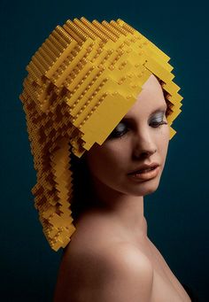 a woman's head is made out of legos and has yellow hair on it