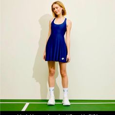 Scoop Neck Sleeveless . Criss-Cross Back Pleated Skirt With Contrasting Logo At Hem Contrasting Trim On Neck And Straps Hidden Shorts Contrasting Trim, Pickleball, Pleated Dress, Criss Cross, Pleated Skirt, Scoop Neck, Prince, Color Blue, Trim