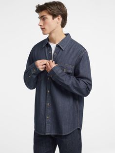 Our denim long sleeve shirt. Keep it casual or make a statement. Made with our signature GUESS JEANS denim featuring GUESS AIRWASH™. Washed Blue Chambray Long Sleeve Denim Top, Long Sleeve Chambray Denim Top In Washed Blue, Dark Wash Chambray Denim Jacket For Fall, Dark Wash Chambray Denim Top For Fall, Fall Dark Wash Chambray Denim Top, Long Sleeve Chambray Denim Top With Button Closure, Fall Denim Tops With Snap Buttons, Chambray Long Sleeve Shirt, Relaxed Fit, Chambray Long Sleeve Shirt With Relaxed Fit