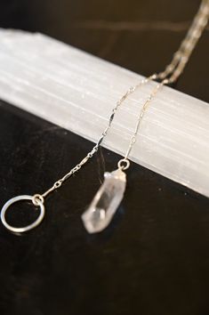 A Quartz necklace unlike any other! This beautiful & timeless Quartz lariat necklace weaves through the circle, allowing you to adjust where the circle sits on your chest. Quartz is the Power Stone, helping you see the Vision you are creating for your life and walk that path with crystal clarity. Pair this gorgeous lariat necklace with our Circle of Life Necklace. Clear Quartz pendant approximately 3/4" in length Sterling silver bar chain and circle ring Necklace is a singular chain without a cl Power Stone, Silver Bar, Circle Ring, Mala Necklace, Circle Of Life, The Vision, Silver Bars, The Circle, Quartz Pendant