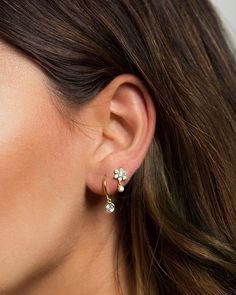 "Small but dazzling, these delicate stud earrings feature shiny flower-shaped zirconia gemstones and a tiny bezel-set CZ drop charm. Look gorgeous worn alone to add some sparkle to your ears and also layer beautifully with other studs and hoops for those with multiple piercings. * D E T A I L S * ∙Sold individually (1 earring) or by pair (2 earrings) ∙ Material: .925 Sterling Silver or 18K Gold Plated over .925 Sterling Silver ∙ Stone: White Zirconia ∙ Dimensions: Flower: 7mm // Total height: 12 Elegant White Gold Piercings, White Gold Piercings With Matching Earrings, Fine Jewelry Cartilage Drop Earrings, Fine Jewelry Flower Shaped Earrings For Pierced Ears, Fine Jewelry Drop Cartilage Earrings, Tiny Minimalist Flower Earrings, Dainty Single Flower Shaped Earring, Dainty Flower Earrings With Cubic Zirconia, Dainty Flower Earrings In Cubic Zirconia