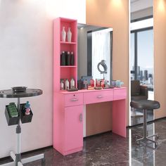 a pink vanity with mirror and stool in a room