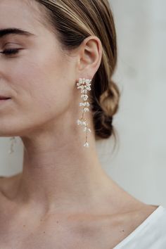 Inspired by the delicate structure of Dandelion heads, the Nona Earrings are a statement design made from intricately hand beaded flowers. This design has beautiful cascading movement inspired by the way dandelion seeds float away in the wind. Eden b. Studio has been creating beautiful bridal accessories for over 7 years. New to Etsy! Coordinating Nona Headband, Hairpins and Haircomb available -Measurements: length 8cm | width 2cm -Designed & hand made in our studio the UK -Made to order in 2-4 Jewelry For Bride, Statement Earrings Wedding, Wedding Jewelry For Bride, Bridal Earrings Drop, Wedding Earrings Drop, Earrings Beaded, Wedding Jewelry Earrings, Silver Plated Jewelry, Prom Wedding