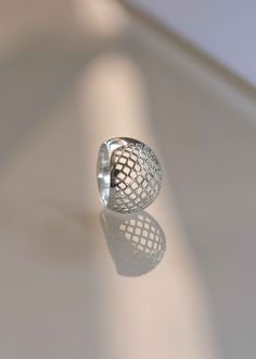 Like wearing modern art on your hand! Our Lattice Dome Ring draws inspiration from simple yet complex patterns in Geometry. Expertly handmade and hand finished with 925 sterling silver making it an investment piece you will treasure for a lifetime. Handmade jewelry is always thicker in gauge and higher in quality. D E T A I L S > Materials - .925 sterling silver > Dimensions: 16mm or .6 inches wide, Dome height 5.20mm or .2 inches > Weight - .20oz approximately >> If your size is Adjustable Sterling Silver Dome Ring In Modern Style, Elegant Adjustable Silver Dome Ring, Modern Adjustable Sterling Silver Dome Ring, Adjustable Modern Sterling Silver Dome Ring, Chunky Silver Rings, Complex Patterns, Artisan Rings, Dome Ring, Sugar Land