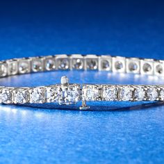 Ross-Simons - 10.00 ct. t. w. Diamond Tennis Bracelet in 14kt White Gold. 7". Classically styled for the ultimate level of sophisticated elegance. This traditional tennis bracelet dazzles with an impressive 10.00 ct. t. w. of round brilliant-cut diamonds, shimmering from end to end in 14kt white gold. An absolute must-have for any fine collection - you will feel such a glow when you try it on. Single-latch safety. Push-button clasp, diamond tennis bracelet. Diamond birthstones are the perfect gi Luxury Round Cut Tennis Bracelet For Formal Occasions, Luxury Tennis Bracelet With Round Cut For Formal Occasions, Platinum Tennis Bracelet With Diamond Accents, Exquisite Platinum Tennis Bracelet With Diamond Accents, Formal White Gold Tennis Bracelet With Diamond Accents, Formal Platinum Tennis Bracelet With Diamond Accents, Luxury Tennis Bracelet With Diamond Accents For Formal, Platinum Diamond Cut Tennis Bracelet, Timeless Formal Tennis Bracelet With Brilliant Cut