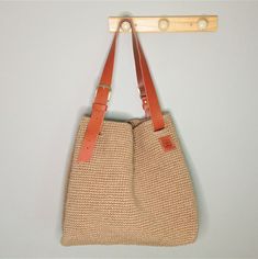 "This is a slouchy hobo bag made of jute with genuine leather handle, measuring 41x45cm (16x18\"). This hobo bag will become an indispensable companion in your everyday life, it will remember every fabulous trip and unforgettable vacation, and at home it will remind you of the sound of sea waves and the bustle of a European town. It can also become your favorite crocheted beach bag. You will definitely like this jute bag if you appreciate quality, convenience and practicality, as well as minimal Chic Jute Crochet Bag With Leather Handles, Leather Beach Bag For Everyday Use, Chic Crochet Jute Bag With Leather Handles, Jute Crochet Bag With Leather Handles, Crochet Jute Bag With Leather Top Handles, Crochet Jute Bag With Leather Handles, Eco-friendly Beige Bucket Bag For Shopping, Casual Leather Hobo Bag For Beach, Everyday Beach Bag With Leather Handles