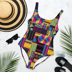 Royal Kente Print One-Piece Swimsuit, African Print bathing suit, Ankara Swimwear, Vibrant Colored Beachwear This one-piece swimsuit for all figures will bring out your best features. Enjoy the smooth fabric and the flattering design, and show it off by the sea or pool! * 82% Polyester, 18% Spandex * Fabric weight: 6.61 oz/yd² (224 g/m²) * Chlorine-resistant fabric * Cheeky fit with a scoop neckline and a low scoop back * Zig-zag stitching * Double-layer front  * Four-way stretch material stretc Fitted Multicolor One-piece For Sunbathing, Multicolor One-piece Bodysuit For Vacation, Tropical Multicolor Bodysuit For Pool, Summer Multicolor One-piece Bodysuit, Multicolor Bold Print Swimwear For Sunbathing, Multicolor Sleeveless Bodysuit For Beach Party, Bold Print Swimwear For Beach Party, Fitted Multicolor Beachy Swimwear, Multicolor One-piece Swimsuit For Beach Season