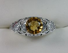 Natural Yellow Citrine Ring Description Etched Wedding Design#160 MADE TO ORDER Here we have a Victorian/Edwardian reproduction ring in sterling silver with a stunning natural yellow citrine gemstone. This full cut round cut .52ct genuine citrine is 6mm in diameter. The inside of the band is marked 925 for sterling. Notice the beautiful floral design of the silver filigree setting and band. This is a lovely rendition of an Antique filigree ring, and it is ready to wear. A gift ring box is includ Traditional Oval Filigree Wedding Ring, Hallmarked Round Cut Topaz Wedding Ring, Classic Citrine Rings For Wedding, White Gold Citrine Topaz Wedding Ring, Wedding Hallmarked Round Cut Topaz Ring, Classic Citrine Wedding Rings, Traditional Yellow Gold Rings For Formal Occasions, Traditional Yellow Rings For Formal Occasion, Classic Filigree Topaz Ring For Anniversary