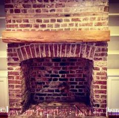 an old brick fireplace in a room