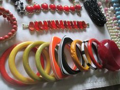 Beautiful vintage lot from 1940s - 1980s plastic Bakelite Lucite, sterling Lucite Faux pearls  and Celluloid jewelry all in good vintage condition. You will find 36 bracelets, 1 belt, 12 necklaces, 9 pair of earrings, 1 fur clip, 1 ring, and 6 brooches with some signed pieces such as Design by Paula, Meriam Haskell, Coro, Lisner, Monet, Avon and more. Due to the size of the lot all sales are final. Retro Handmade Bangle Jewelry, Retro Multicolor Bracelet Jewelry, Vintage Lucite Bangle Bracelet, Vintage Bakelite Bangle Jewelry, Vintage Bakelite Bangle, Handmade Retro Bakelite Jewelry, Retro Bakelite Jewelry As Gift, Retro Red Bracelet Jewelry, Retro Multicolor Round Jewelry