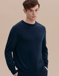 Our Cotton Knit Sweater is a necessary contemporary basic with impeccable quality; the timeless design will endure season after season. The mid-weight material makes the piece perfect for a range of climates - wear it as a layering piece over a shirt in Fall and under a coat in cooler months.

A mid-weight knit made from our premium Flamed Mercerized Peruvian Pima cotton yarn, which gives the piece its lustrous appearance. The Mercerization process also increased fiber strength and affinity to d Classic Fine Knit Outerwear For Work, Spring Merino Wool Top With Ribbed Collar, Classic Long Sleeve Outerwear With Ribbed Cuffs, Relaxed Fit Long Sleeve Merino Wool Tops, Merino Wool Sweater For Spring Workwear, Spring Merino Wool Sweater For Work, Spring Merino Wool Sweater With Ribbed Collar, Classic Merino Wool Outerwear For Spring, Spring Merino Wool Long Sleeve Outerwear