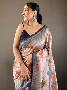 This stunning saree features a beautiful combination of peach and blue colors, adorned with intricate kalamkari print work that adds a traditional touch to the ensemble. The saree also comes with attached tassels on the pallu, adding a playful yet fashionable element to the overall look.
Crafted from high-quality silk fabric, this saree exudes a luxurious feel and drapes beautifully on the body. The similar color silk material blouse complements the saree perfectly, making it a complete traditio Peach Semi-stitched Chanderi Saree, Art Silk Saree With Dupatta In Peach, Peach Art Silk Saree With Dupatta, Peach Unstitched Saree Traditional Wear, Unstitched Peach Saree, Unstitched Peach Saree Traditional Wear, Art Silk Saree With Kalamkari Print In Traditional Drape, Art Silk Saree With Kalamkari Print, Peach Semi-stitched Saree With Traditional Drape