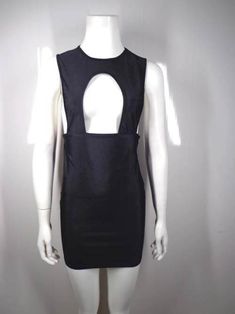 a white mannequin wearing a black dress with an open back and cutout