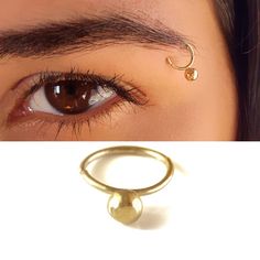 Unique Tribal Eyebrow Ball Piercing Ring, a Boho-Hippie Eyebrow Ring made of 14k Solid Gold, Unisex Indian Piercing Jewelry, Statement Jewelry for Women and Men Ramp up your fashion statement factor and get yourself unique eyebrow-piercing jewelry! This unique eyebrow-piercing ring is sure to make a statement made of the finest 14k solid gold. Intended to highlight pretty features in your appearance or to add a cool edge to your style, it also fits different Piercing Locations: nose ring, Septum Indian Piercing, Piercing Locations, Pretty Features, Eyebrow Piercing Jewelry, Eyebrow Ring, Eyebrow Piercing, Piercing Ring, Nose Ring Stud, Nose Stud