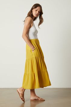 An essential if ever there was one. Crafted from our signature cotton gauze, this midi-to-maxi skirt can quite literally be styled to go anywhere–from work to vacation–with its easy tiers, elastic waist and always-essential in-seam pockets. Breezy Ruffled Tiered Maxi Skirt, Breezy Tiered Maxi Skirt With Ruffles, Breezy Tiered Ruffle Maxi Skirt, Breezy Tiered Maxi Skirt, Chic Tiered Maxi Skirt For Summer, Breezy Tiered Flowy Maxi Skirt, Breezy Tiered Maxi Skirt For Summer, Cotton Ruffled Maxi Skirt For Day Out, Summer Tiered Maxi Skirt For Day Out