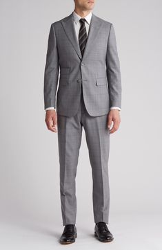 Sophisticated peaked lapels smarten the jacket of this trim-fit suit crafted from a fine wool blend and finished in a handsome windowpane plaid print. 36 1/4" inseam; 7 3/4" leg opening; 10 1/2" rise (size 38R) Jacket has peaked lapels; chest welt pocket; front flap pockets Unhemmed Lined 90% wool, 10% polyester Dry clean Imported Notch Lapel Three-piece Suit For Office, Three-piece Notch Lapel Suit For Office, Fitted Professional Tuxedo For Office Wear, Notch Lapel Tuxedo Suits For Office Wear, Classic Tailored Single Breasted Pantsuit, Classic Tailored Single-breasted Pantsuit, Fitted Tuxedo Suit For Office Wear, Fitted Office Wear Blazer In Suiting Fabric, Tailored Three-piece Suit With Notch Lapel For Office