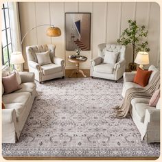 a living room with couches, chairs and a rug on the floor in front of a window