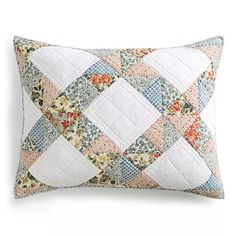 a white and blue quilted pillow on a white background