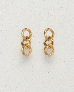 Three perfect 18k gold plated lil' links make Damien an earring somewhere between a drop earring or a stud. When you just need a teeny bit of dangle, Damien is your go-to pair. Classic, lightweight, and a nice alternative to a hoop. Made from premium quality materials, st. Moran jewelry is designed to last. At our atelier, we believe in crafting jewelry to withstand everyday wear without tarnishing. Gold Tarnish-resistant Dangle Cartilage Earrings, Gold Tarnish-resistant Drop Cartilage Earrings, Gold Plated Drop Cartilage Earrings, Trendy Gold-tone Pierced Earrings, Trendy Single Gold-tone Earring, Yellow Gold Link Earrings, Trendy Gold-tone Single Earring, Tarnish Resistant Link Earrings, Tarnish Resistant Metal Dangle Cartilage Earrings