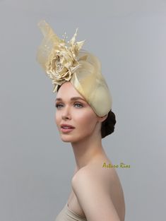 From my 2024 Collection. This beautiful Gold/champagne fascinator is made on pillbox base covered with a shimmery fabric, embellished with a Custom-made Silk rose with leaves. Crystal stems and Crinoline. Elastic string attached to the pillbox. Hat box included. All my hats are hand made to order, please allow 1-2 weeks, If this is a rush order, please contact me before ordering. All sales are final. Royal Ascot Evening Fascinator With Structured Crown, Evening Headpiece With Pinched Crown For Kentucky Derby, Evening Pinched Crown Headpiece For Kentucky Derby, Luxury Gold Hat For Kentucky Derby, Evening Fascinator With Pinched Crown For Kentucky Derby, Royal Ascot Headband Fascinator For Event, Royal Ascot Headband Fascinator, Royal Ascot Evening Mini Hat With Pinched Crown, Royal Ascot Event Headband Fascinator