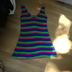 "This is one funky little mini from the 70's. The fabric is a poly/jersey blend and the design is bold colored stripes...hot pink, lime green and royal blue. Scoop necked with zipper down back. It could be worn as a mini dress or as a fun top with leggings. Hand made many years ago, still in nice wearable shape. Measurements: 36\" bust; mid body 33\"; 38\" hips; 51\" hemline; 32 1/2\" tall. Thanks for stopping by my Etsy shop!" Spring Fun Mini Dress, Striped Cotton Mini Dress, Trendy Striped Mini Dress, Vintage Cotton Mini Dress, Vintage Blue Mini Dress For Summer, Striped Fitted Cotton Mini Dress, Retro Stretch Mini Dress For Summer, Fitted Striped Cotton Mini Dress, Multicolor Stretch Mini Dress