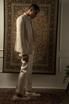 The ivory-layered ensemble exudes a graceful fusion of traditional and contemporary elements, with an unmistakable Indo-Western essence. Crafted from luxurious silk fabric, each layer of the ensemble is adorned with intricate tonal silk thread embroidery, adding an exquisite touch of elegance and sophistication.The ensemble features a stylish kurta with a modern twist, boasting a silhouette that effortlessly blends Eastern and Western influences. The fine embroidery enhances the allure of the ku Indowestern Outfits For Men, Indowestern Outfits, Wedding Clothes For Men, Kurta And Pants, Indian Wedding Clothes For Men, Silk Thread Embroidery, Stylish Kurta, Indian Wedding Clothes, Simple Kurti