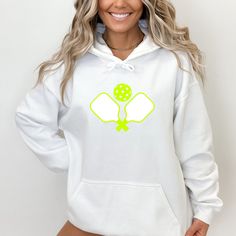 Tasteful pullover hoodie for the Pickleball Aficionado. Feel stylish and on trend in this cotton-blend hoodie designed in NYC. Plush, soft and cozy enough to wear year round.  Crisp drawstring + oversized kangaroo pocket for a chic athleisure vibe. -  50% cotton, 50% polyester -  Medium-heavy fabric (8.0 oz/yd² (271 g/m -  Classic fit -  Tear-away label -  Runs true to size -  Wash cold/ tumble dry low or natural air dry  2-5 Business Days for shipping/delivery  PLEASE FEEL FREE TO PM STONE WITH ANY QUESTIONS White Hooded Hoodie For Light Sports, White Moisture-wicking Hoodie For Sports, White Hooded Sweatshirt For Light Sports, White Moisture-wicking Hoodie For Workout, Casual White Hoodie For Light Sports, White Hoodie For Sports Season, White Hoodie Sweatshirt For Sports, White Sweatshirt With Drawstring Hood For Light Sports, Sporty Long Sleeve Sweatshirt For Tennis