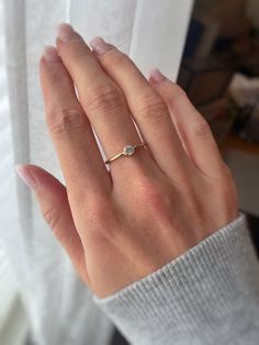 A delicate 14k Gold Filled ring featuring a sparkly and beautiful cubic zirconia diamond. The stone is 4mm in size. Great as an everyday ring, promise ring or to stack with others! Listing is for single (1) ring only.   Details: 14k Gold Filled 5A Cubic Zirconia diamond, 4mm in size Fits true to size Handmade jewelry, free from lead and nickel Shop all rings here! https://www.etsy.com/ca/shop/StarsAlignJewelry?ref=simple-shop-header-name&listing_id=684482651&section_id=26258580 If for any reason Simple Gold Rings Everyday, Simple Diamond Ring, Single Pearl Necklace, Ring Everyday, Pearl Drop Necklace, Gold Rings Simple, Gold Rings Stackable, Everyday Ring, Simple Diamonds