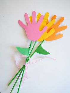 paper flowers with the words easy hand shaped flower craft on it's bottom corner