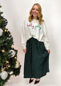 Add a touch of elegance to your wardrobe with this green checkered A-line midi skirt! Its flowy silhouette and timeless pattern make it perfect for any occasion. Pair it with your favorite top for a chic, effortless style. Scott And Allison, Holiday Lookbook, Green Checkered, Velvet Heart, Oversized Crewneck, Script Lettering, Love Is Free, Holly Jolly, Effortless Style