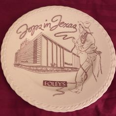 a white plate with an image of a woman walking in front of a building and the words, open jesus follys