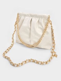 In a match-all cream colourway, our Duo hobo bag will slot in seamlessly with your neutral outfits. It features an effortlessly chic slouchy hobo sillhouette and a capacious interior to store your daily essentials such as your lipstick, compact and wallet. Bonus points for the double chain handles, which unlocks double the styling options while amping up the glam factor. Charles And Keith, Bag Photography, Chic Purses, Sale Off, Size Chart For Kids, Charles Keith, Braided Strap, Double Chain