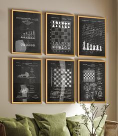 a living room filled with furniture and framed pictures on the wall above a green couch