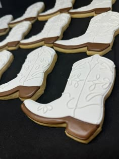 "Looking for a unique party flavor for your western theme wedding or bridal shower? Cowboy boot cookies are a great option!  Color scheme is changeable, but these white on white boot cookies have an elegant appeal and are even more beautiful in person! This listing includes 12 hand decorated, individually wrapped cookies. Feel free to request  color scheme changes by noting it in the \"personalization\" field on your order form, along with your event date, and I will make everything to your spec Western Boots Wedding, I Do Party, Western Chic Party Decor, Cowboy Engagement Party, Western Themed Graduation Party, Bachelorette Party Themes Western, Boot Cookies, Boots And Bubbly Bridal Shower Cookies, Country Western Bridal Shower Ideas