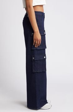 Classic cargo pockets give utilitarian appeal to these wide-leg jeans crafted from breathable low-stretch denim. 33" inseam; 25 1/2" leg opening; 10 1/2" front rise; 15" back rise Zip fly with button closure Front scoop pockets; cargo snap-patch pockets 99% cotton, 1% spandex Machine wash, tumble dry Imported Utility Mid-rise Flare Jeans With Patch Pockets, Utility Style Mid-rise Flare Jeans With Patch Pockets, Dark Wash Straight Leg Cargo Jeans With Patch Pockets, Utility Style Full Length Flare Jeans With Patch Pockets, Utility Style Wide Leg Flare Jeans With Patch Pockets, Denim Blue Utility Flare Jeans, Utility Flare Jeans With Five Pockets In Denim Blue, Denim Blue Jeans With Flap Pockets For Work, Wide Leg Jeans With Flap Pockets For Work