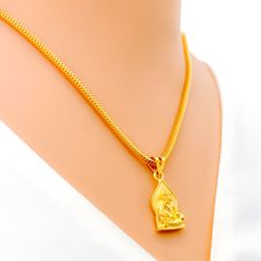 This attractive pendant, exquisitely crafted from 22k gold and weighing 3.2 grams, features a finely engraved depiction of Sai Baba set against a luminous yellow gold finish. The pendant has a length of 0.9 inches, making it both noticeable and modest in size, ideal for daily wear. Perfect for devotees who wish to keep Sai Baba close to their hearts, this pendant combines spiritual devotion with elegant craftsmanship, offering a timeless piece that embodies grace and serenity. PRODUCT DETAILS Gold Purity(karat): 22k Gold Weight(grams): 3.2 Item Finish: Yellow Gold Pendant Length: 0.9" Chain: Not Included 22k Gold Locket Jewelry, Traditional Yellow Locket Jewelry, Gold Plated Pendant Jewelry For Puja, Gold Plated Pendant For Puja, Gold Temple Necklace With Locket For Wedding, Gold Locket Temple Necklace For Weddings, Gold Locket Jewelry For Diwali, Gold Plated Locket For Puja, 22k Gold Hallmarked Temple Necklace Pendant