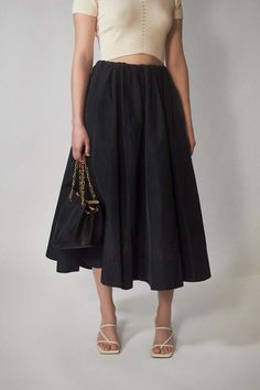 Cut from our luxurious and crisp silk taffeta francina is a high-waisted midi skirt with a voluminous a-line silhouette. beautifully crafted it is framed by a concealed elastic waistband and ends above the ankle.    - 69% polyester 31% silk  - voluminous a-line silhouette  - made in portugal    fits true to size Voluminous A-line Skirt For Evening, Chic Black Silk Skirt, Black A-line Voluminous Skirt, Cocktail A-line Skirt With Pleated Waist, Silk Full Skirt For Work, Evening Voluminous Midi Skirt, Silk Skirt With Pleated Waist For Work, Black Pleated Silk Skirt, Evening Full Skirt Bottoms With Elastic Waistband