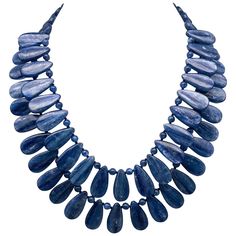 One-of-a-Kind Kyanite is a gemstone that is prized for its rich and vibrant blue color, which is even stronger and more vibrant than traditional Sapphire. When faceted, Kyanite can often be sold as Sapphire, but it is the natural, highly polished, opaque gemstone that truly shines. This necklace features two strands of perfectly matched teardrop-shaped Kyanite beads, separated by polished Kyanite beads for added texture and interest. The matching Kyanite and Sterling Silver clasp add a touch of Artisan Bracelets, Silver Bead Necklace, Cultured Pearl Necklace, Baroque Pearl Necklace, Tourmaline Necklace, Blue Kyanite, Sea Pearls, Stunning Necklace, True Blue